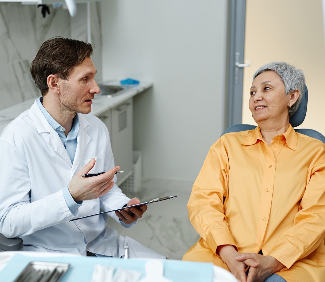 Smiling patient in a dental chair